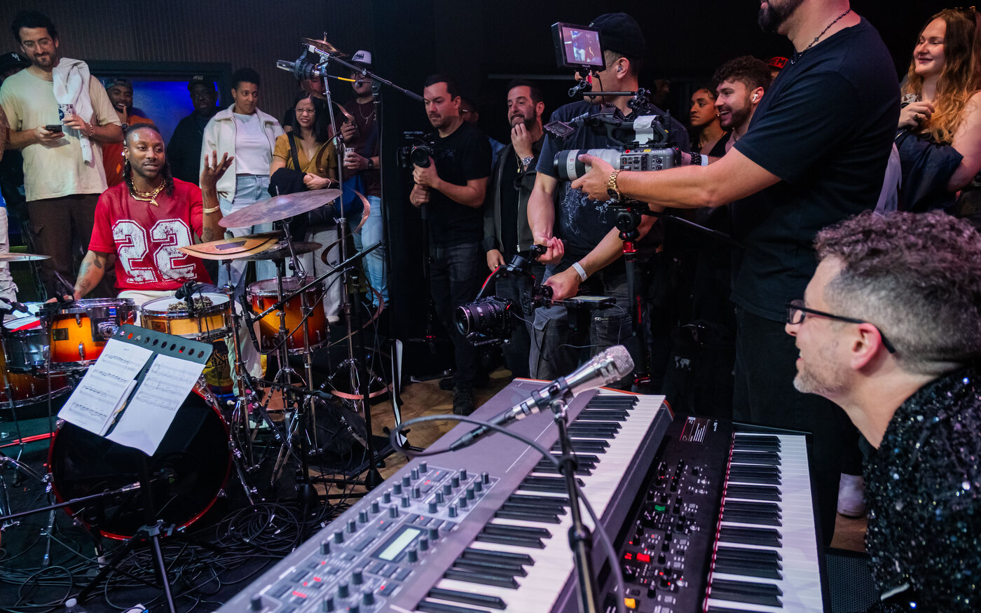 Greg Spero at the keys and Mike Mitchell at the drums, playing in the round at The Recording Club, crowd standing on every side